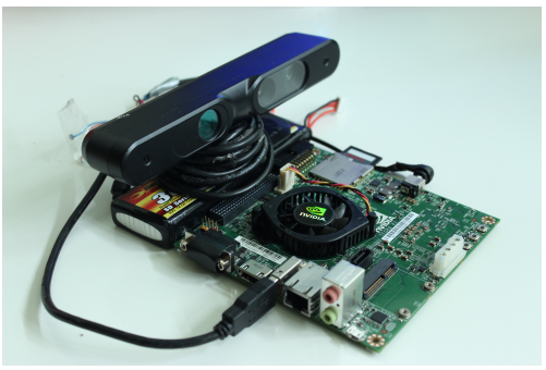 Figure 5: Jetson board connected to the ASUS Xtion depth sensor on top of a battery.